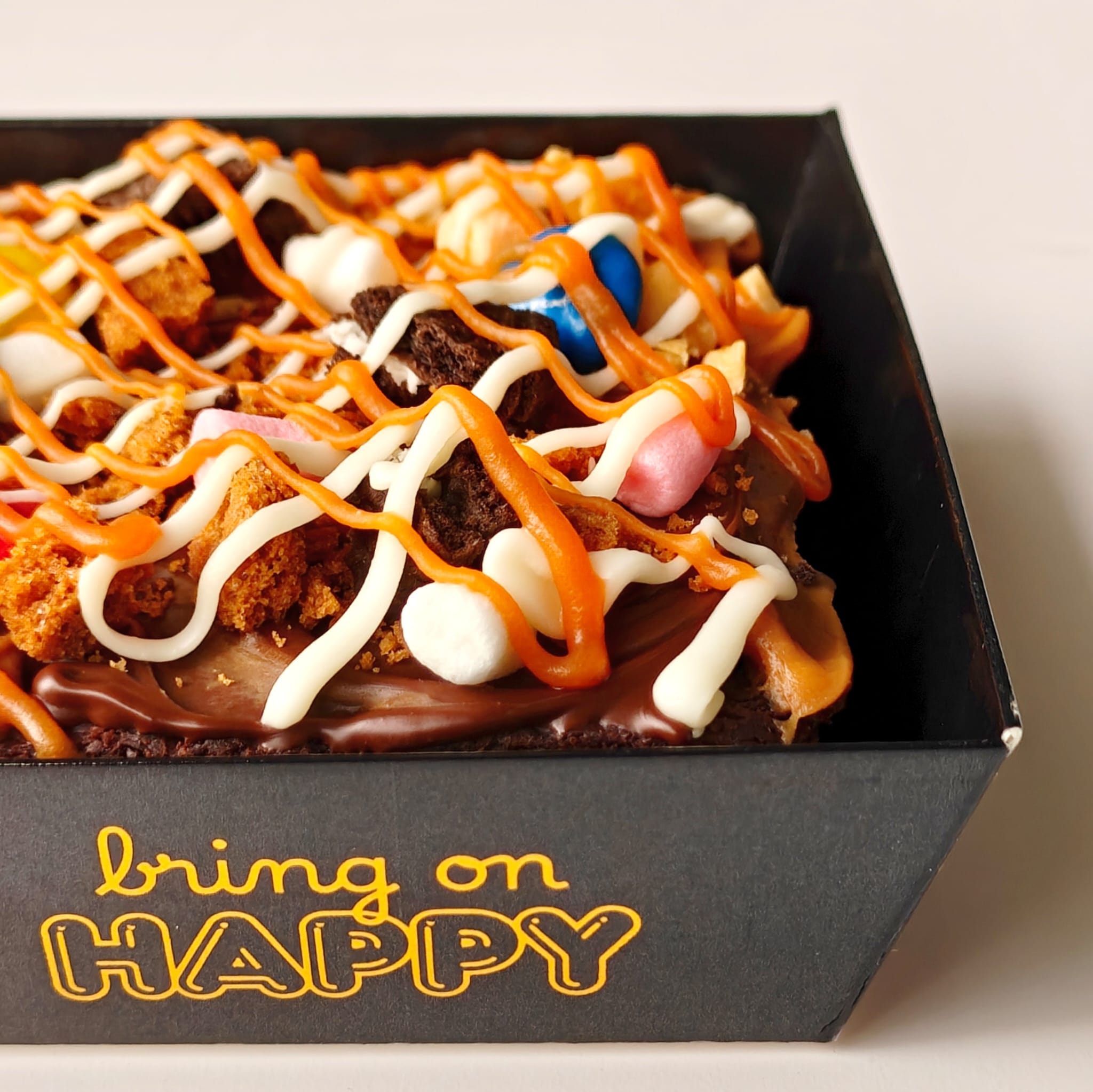 Loaded Brownie Rush with Nutella, peanut butter, Oreos, M&Ms, marshmallows, Biscoff, walnuts, white chocolate, and caramel sauce